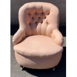 A Victorian button back open armchair, with a shel