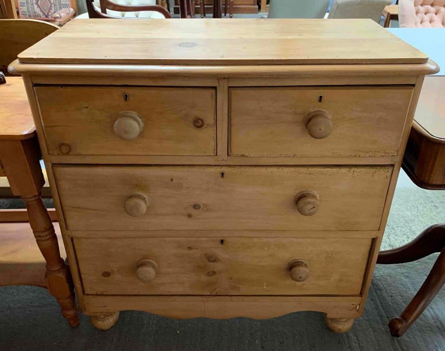 A Victorian pine chest of drawers, of two long and