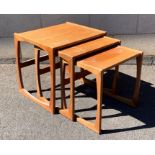 A nest of three mid-century Nathan teak occasional