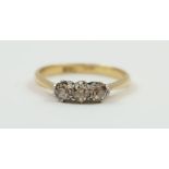 A diamond three stone ring, marked '18ct plat', th