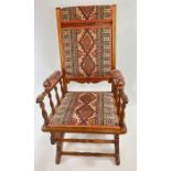 A 20th century American rocking chair, upholstered