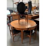 A mid century G - Plan teak circular extending di