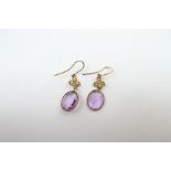 A pair of early 20th century amethyst and seed pea