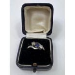 WITHDRAWN A sapphire and diamond three stone ring, marked '1