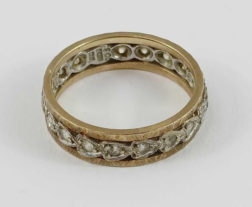 A 9ct gold white stone full eternity ring, each st