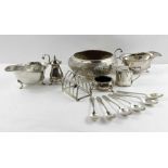 A pair of silver sauce boats, a silver toast rack
