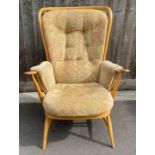 A modern beech and elm Ercol open armchair