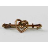 A bar brooch with a heart and flower decoration, m