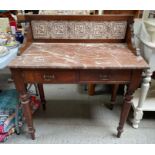 A 20th century marble topped sideboard with tiled