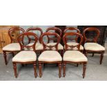 A set of 20th century mahogany balloon back chairs