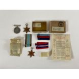Three WWII military medals, in the original box