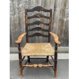 A 19th century mahogany ladder back armchair, with