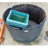 Metal bound half barrel planter along with 3 plast