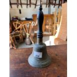 Antique bell on an ebonised handle