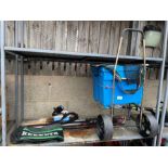 Fishing tackle box on wheels, fishing rods, a reel