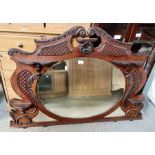 Ornate carved mahogany over mantle mirror