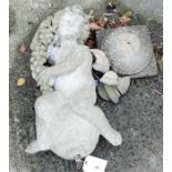 Reconstituted stone cherub