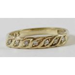 A 9 carat gold seven stone diamond half hoop ring,