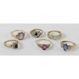 A collection of six stone set rings, some hallmark