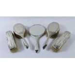 A matched five piece silver backed dressing table