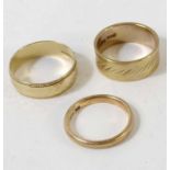 A collection of three 9 carat gold wedding rings,