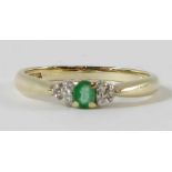 A 9 carat gold emerald and diamond ring, the emera