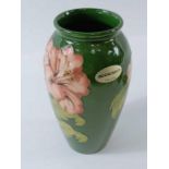 A Moorcroft pottery vase in the Hibiscus pattern,