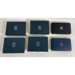 A collection of six United Kingdom proof coin sets