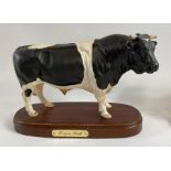 A Royal Doulton ceramic model of a Friesian bull,