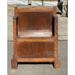 A 20th century oak hall seat, with a lift up secti