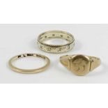 A 9 carat gold signet ring; wedding ring; and an e