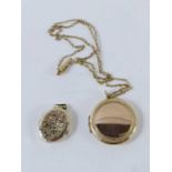 A round locket with a simple border pattern, marke