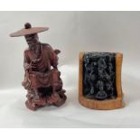 A Chinese carved wooden figure of a seated man smo