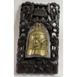 A 20th century Chinese table bell and carved