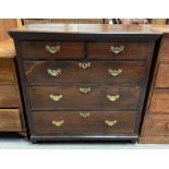 A 19th century oak chest of drawers, with brass sw