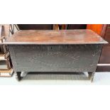 An18th century oak coffer with a carved front pane