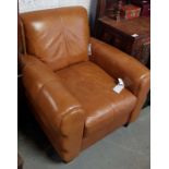 Tan leather armchair