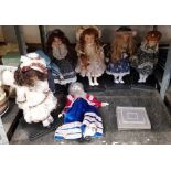 Collection of vintage dolls on plastic stands