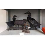 2 cast iron duck doorstops, cast iron ram doorstop