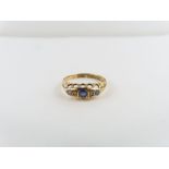 An 18ct gold sapphire and diamond ring, finger s