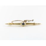 A sapphire and seed pearl bar brooch, stamped ’15c