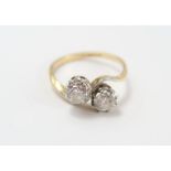 A two stone diamond cross over ring, stamped ‘18ct