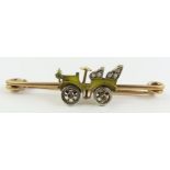 A rose cut diamond and yellow enamel car brooch,