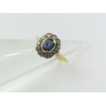 A sapphire and diamond cluster ring, unmarked, fin