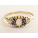 A 9 carat gold opal and sapphire set dress ring, f