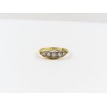 A five stone diamond ring, stamped ‘18ct’, set wit