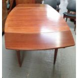 A teak mid century table and four chairs, each uph