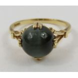 A 14ct gold cat's eye dress ring, finger size L 1/