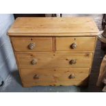 A 20th century pine chest of drawers, of two short