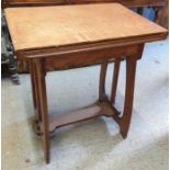 An early 20th century oak Arts & Crafts folding ta